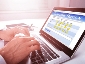 Doctor reading 5-star patient review in Gilbert AZ clinic — Learn how testimonials improve healthcare marketing and local SEO with help from Salterra.